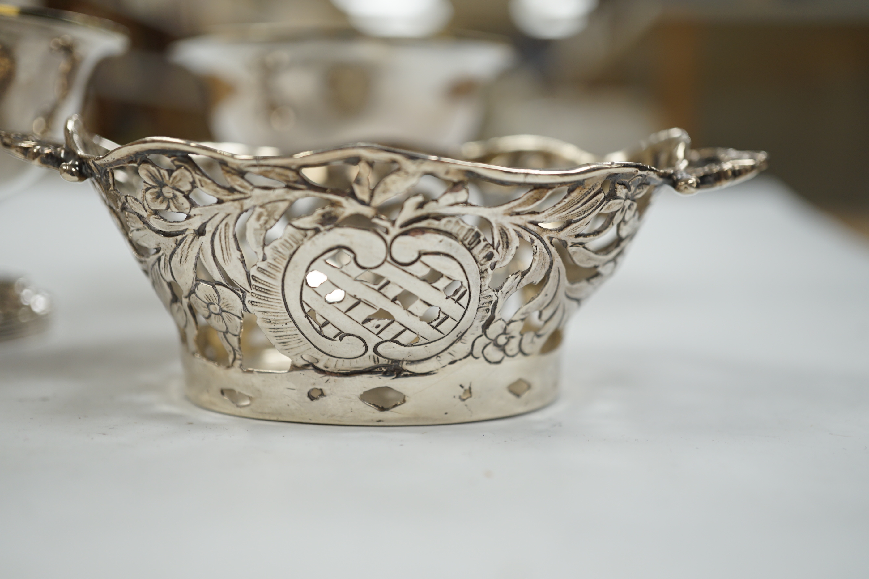 A pair of George III silver circular pedestal salts, John Kidder?, London, 1799, diameter 78mm and a small Hanau silver two handled dish.